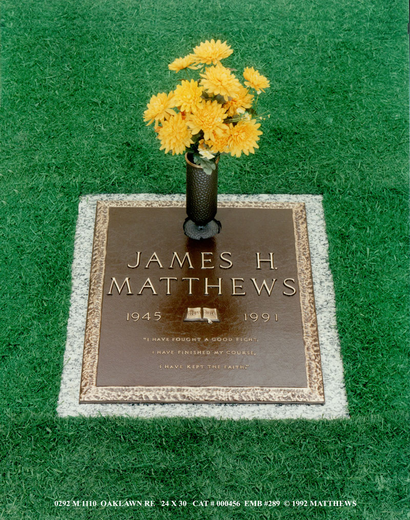 square bronze grave maker with yellow flowers